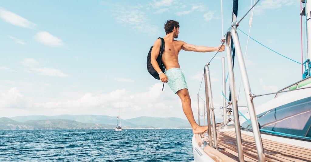 A man enjoys sailing on the Aegean Sea, showcasing freedom and leisure on a sunny day.
